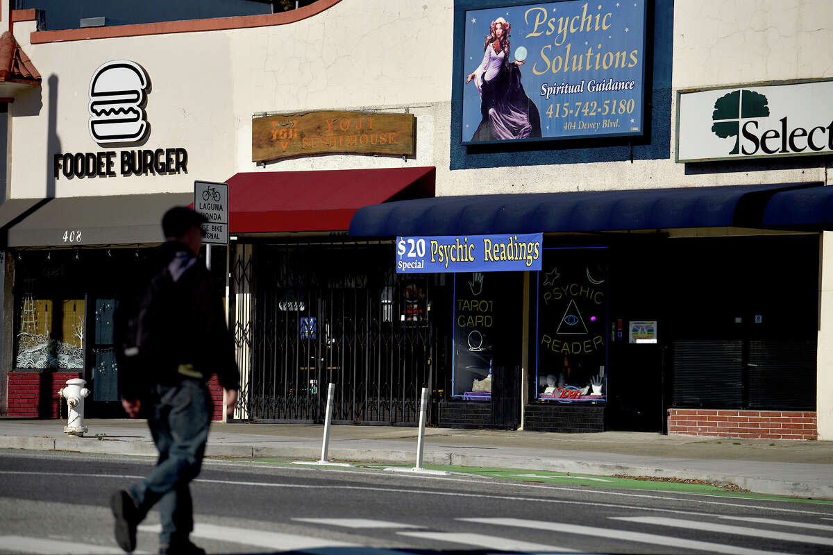 A small cluster of stores lines the intersection of Dewey Boulevard and Laguna Honda Boulevard, next to Forest Hill station.