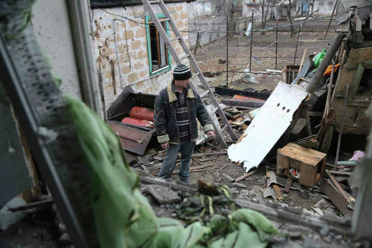 Texans should be appalled that a world leader is weaponizing false historical grievances to attack and deny self-determination to the people of an independent country. Here, a man in eastern Ukraine examines the damage near his home after shelling last week.