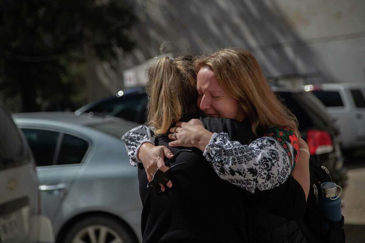Iryna Petrovska Marchiano, president for Ukrainian American Cultural Club of Houston embraces Houston artist Shelbi Nicole as she arrives to see the mural created in support of Ukrainians as they are attacked by Russia, Monday, Feb. 28, 2022, in Houston.