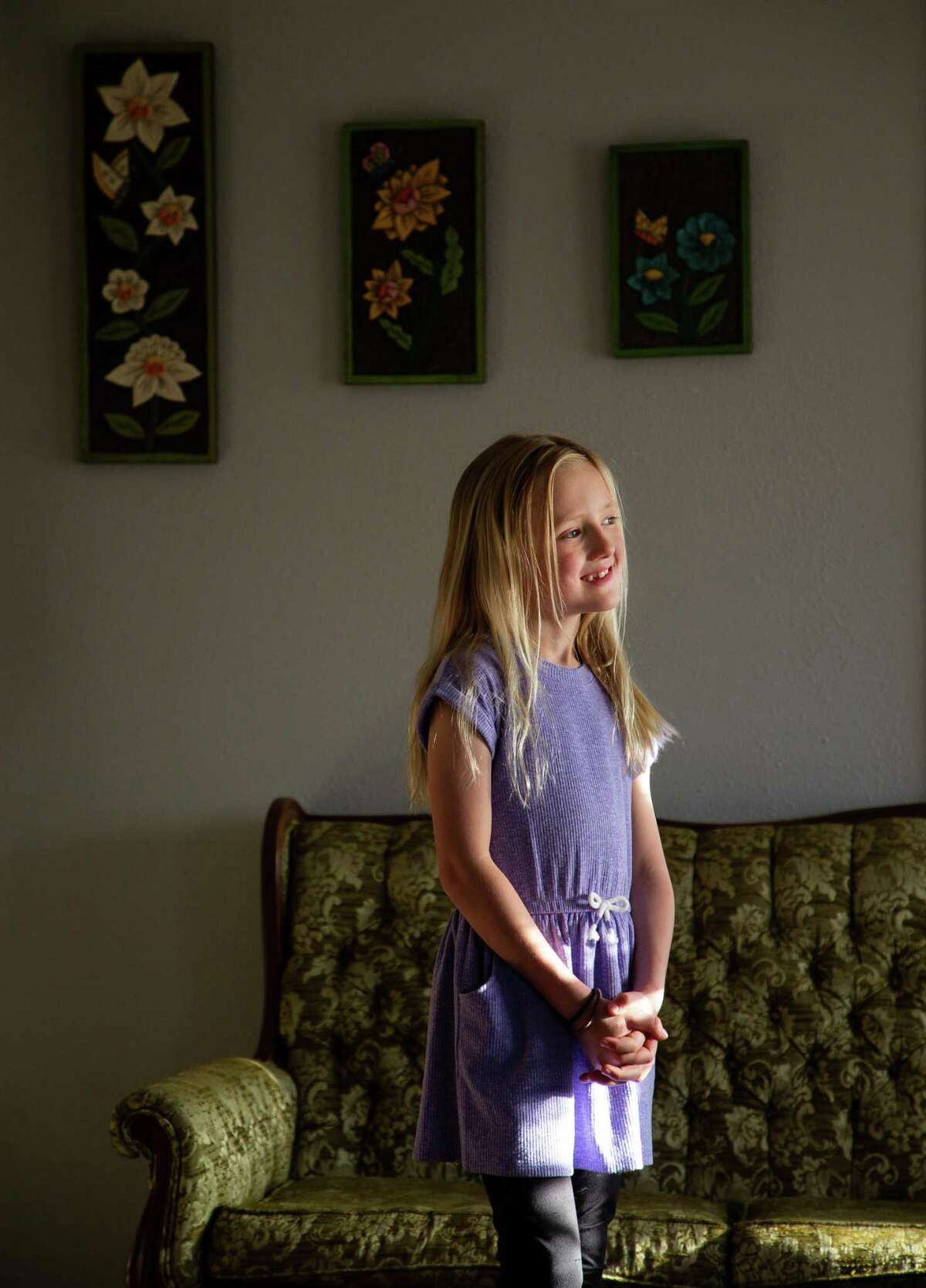 Sunny Bryant, 8, poses for a photograph inside her family’s home on Monday, Feb. 28, 2022, in Houston. Sunny and her parents, who have been outspoken for the rights of transgender children, have been invited as honored guests of U.S. Rep. Sylvia Garcia to virtually attend President Joe Biden's second State of the Union address.