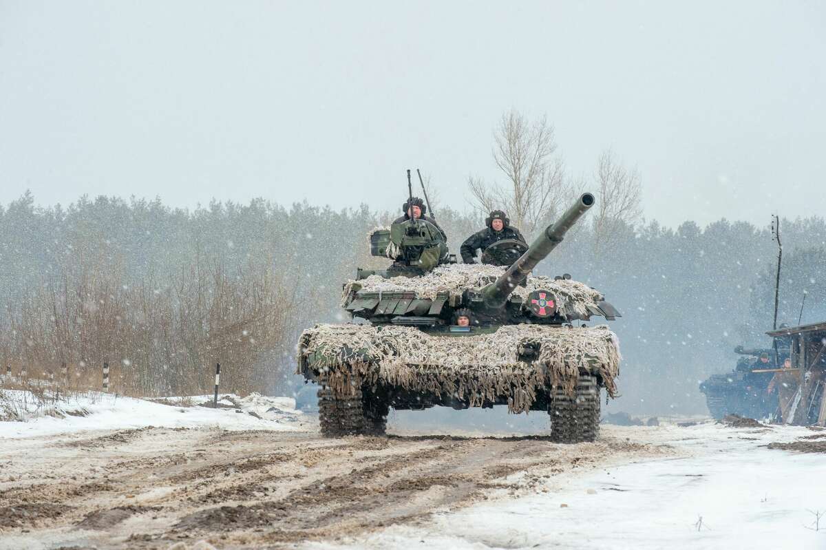 Ukrainian Military Forces servicemen of the 92nd mechanized brigade use tanks, self-propelled guns and other armored vehicles to conduct live-fire exercises near the town of Chuguev, in Kharkiv region. (Photo by Sergey Bobok/AFP via Getty Images)