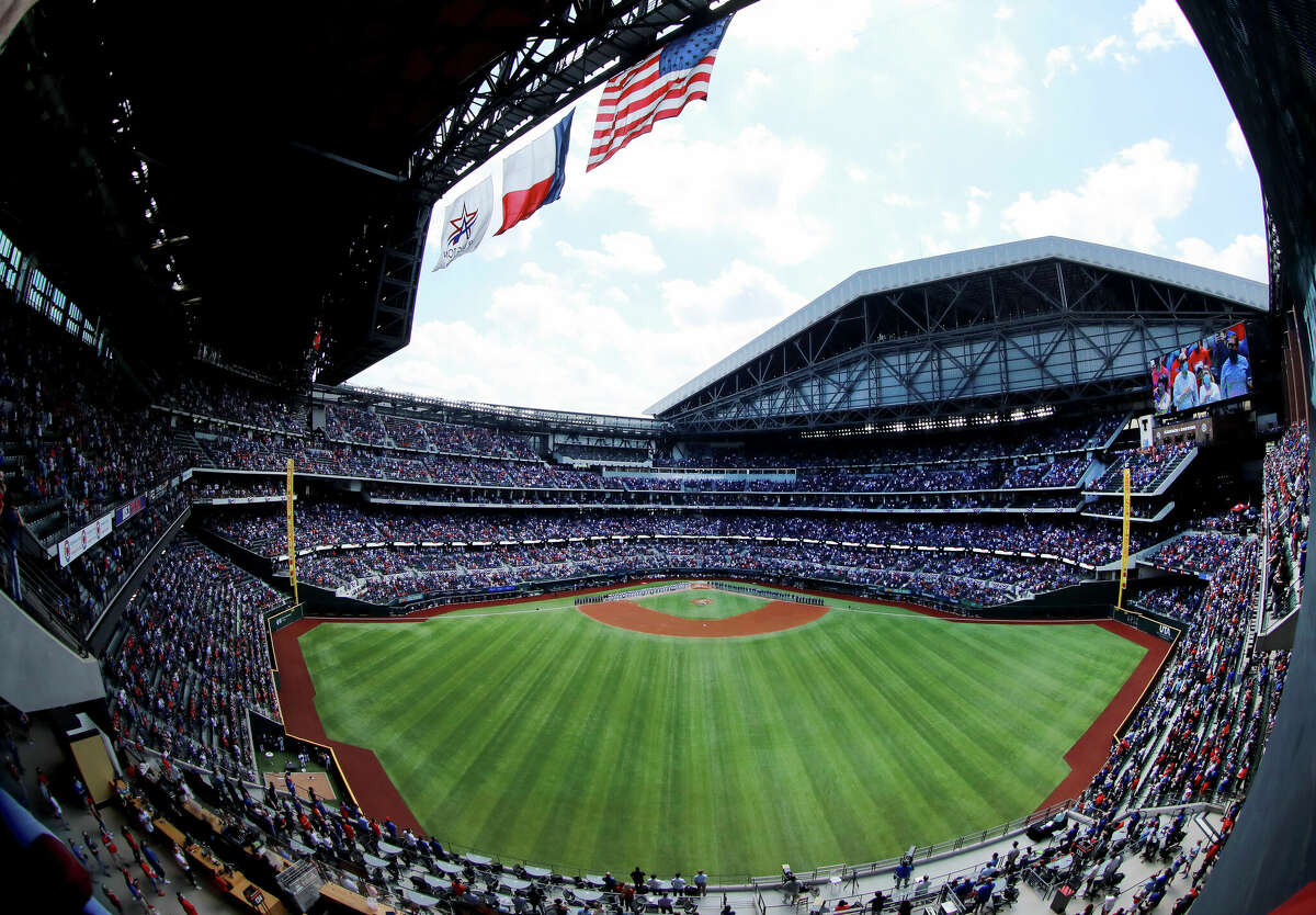 ARLINGTON, TEXAS - APRIL 05: The Texas Rangers and the Toronto Blue Jays stand during the National Anthem on Opening Day at Globe Life Field on April 05, 2021 in Arlington, Texas. (Photo by Tom Pennington/Getty Images)