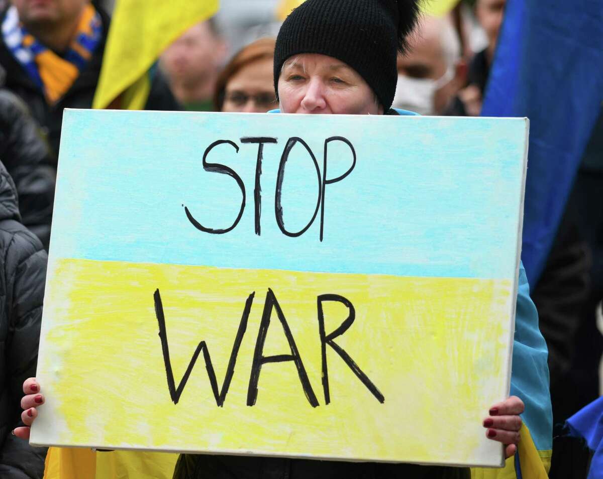 Stamford's Nataliya Marchyshyn holds a sign during the Rally for Ukraine outside Town Hall in Greenwich, Conn. Tuesday, March 1, 2022. More than 200 people came to Greenwich Town Hall Tuesday afternoon to rally support for Ukraine and urge swift action to stop the fighting after the Russian attack began last week.