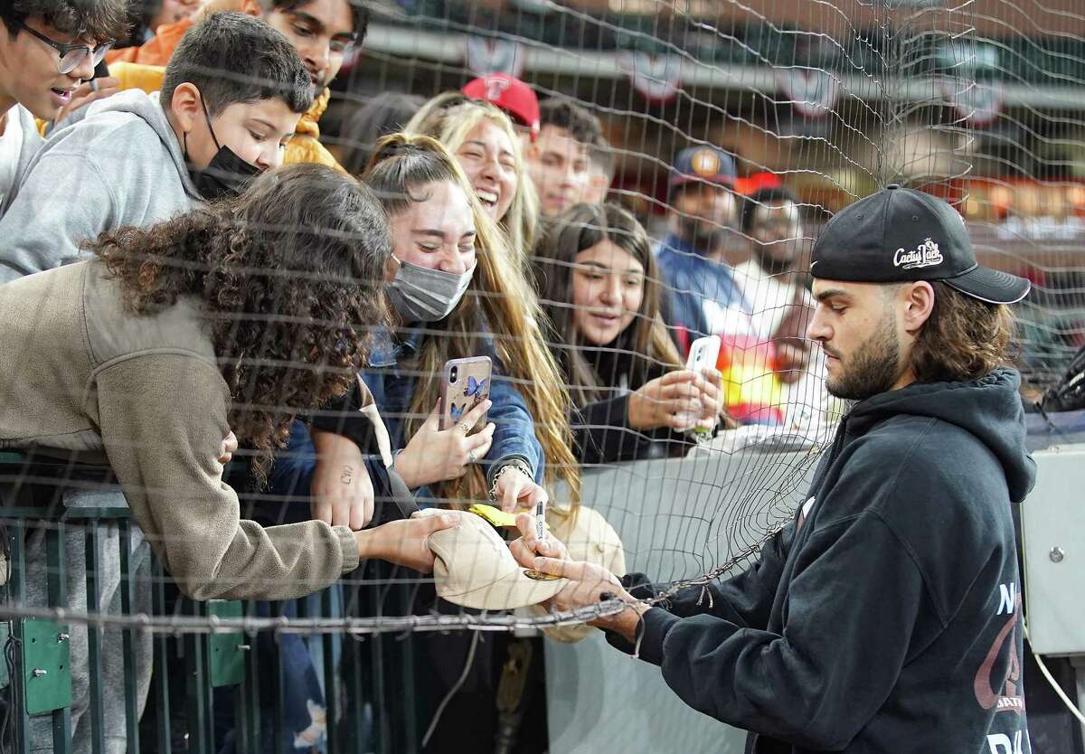 Fans react as Astros Lance McCullers signs autographs before a charity softball game at Minute Maid Park in Houston on Thursday, Nov. 4, 2021.