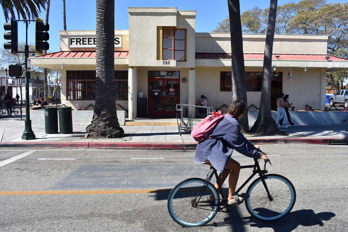 A cyclist rides by Isla Vista's storied Freebirds World Burrito on the edge of the UC Santa Barbara campus. The legendary purveyor of assembly line-style Mexican food has been in the same location since 1987. 