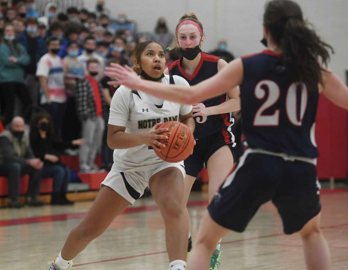Notre Dame of Fairfield's Aizhanique Mayo drives to the basket during the Lancers' victory over New Fairfield in the SWC girls basketball championship at Pomperaug High School in Southbury, Conn. on Thursday, February 24, 2022.