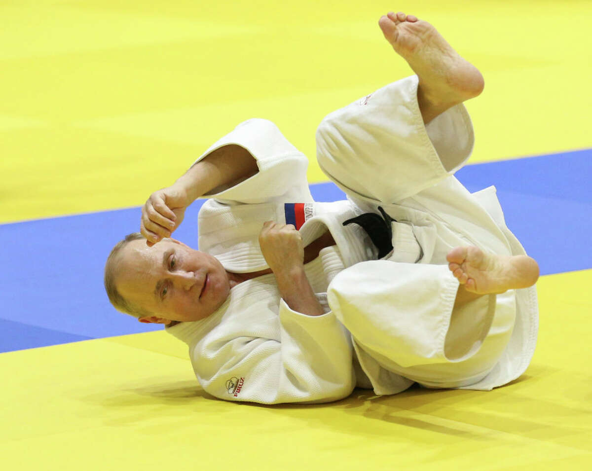Russian President Vladimir Putin falls during judo trainings at Yug Sport complex in Sochi, Russia, February 14, 2019. 
