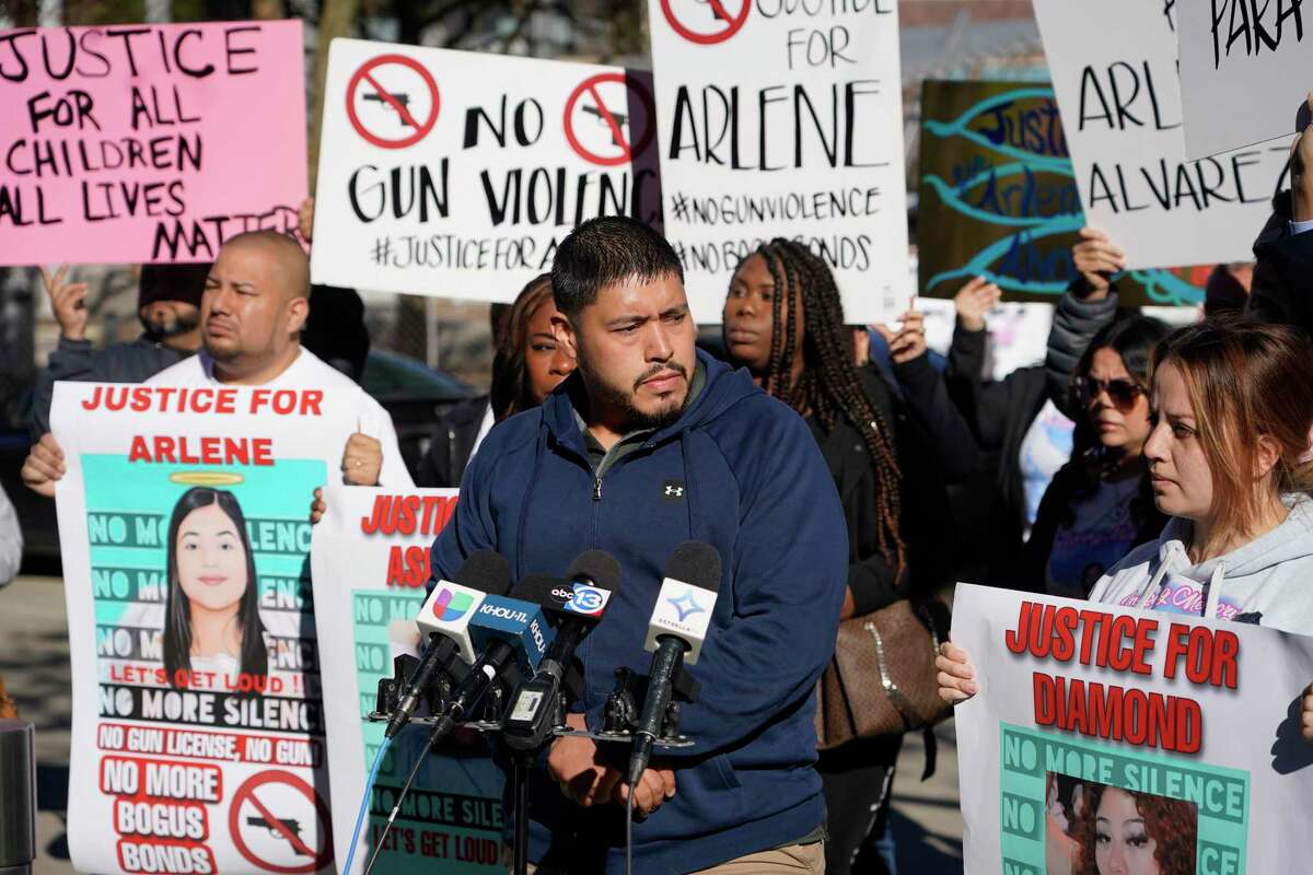 Armando Alvarez, speaks as he and his wife, Gwen Alvarez, right, and others rally outside of the Harris Co. Criminal Justice Center against gun violence Tuesday, March 1, 2022 in Houston. They are parents of Arlene Álvarez, 9, who died after being shot by Tony D. Earls. He has been charged in connection to her death. He was robbed at an ATM and fired at the robbery suspect. She was shot as her family drove by.