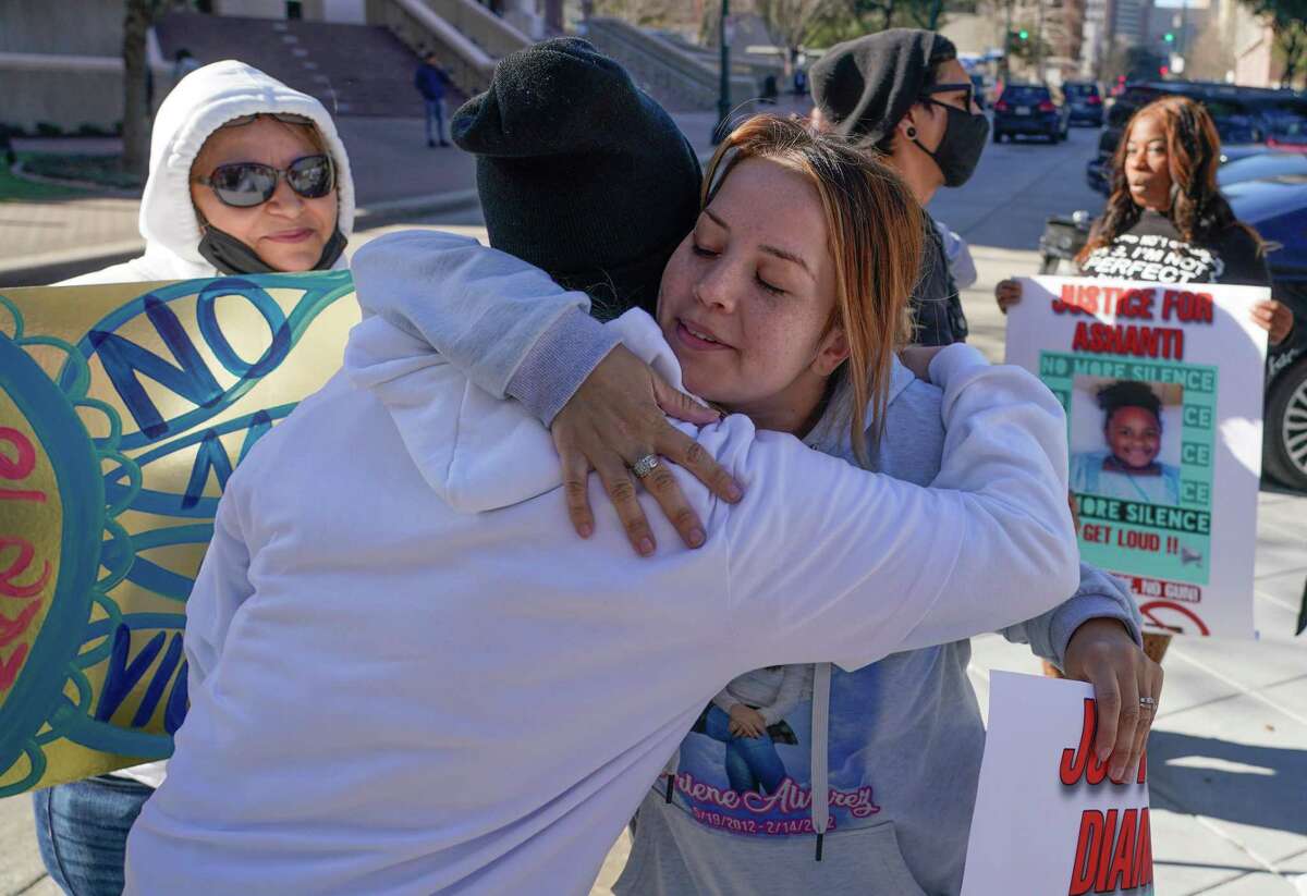 Gwen Alvarez is hugs a supporter as she and others rally outside of the Harris Co. Criminal Justice Center against gun violence Tuesday, March 1, 2022 in Houston. She is the mother of Arlene Álvarez, 9, who died after being shot by Tony D. Earls. He has been charged in connection to her death. He was robbed at an ATM and fired at the robbery suspect. She was shot as her family drove by.