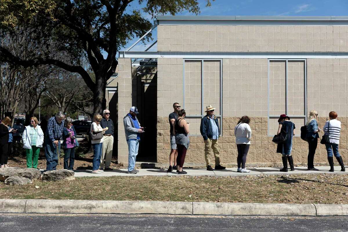 Voters wait in line to cast their votes at the Brook Hollow Branch of the San Antonio Library. Voters will be voting on big bond funding asks next month.