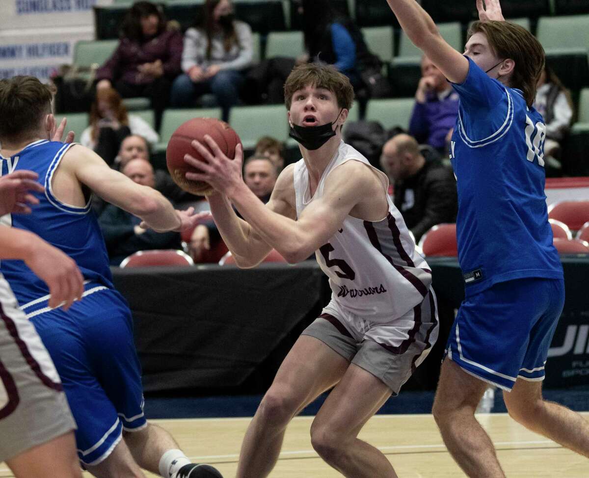 Stillwater’s Carter Lukas Lilac drives to the hoop defended by Hoosic Valley’s Tyler Eddy, right, during the boys Class CC semifinal basketball game at Cool Insuring Arena on Tuesday, March 1, 2022 in Glens Falls, N.Y.