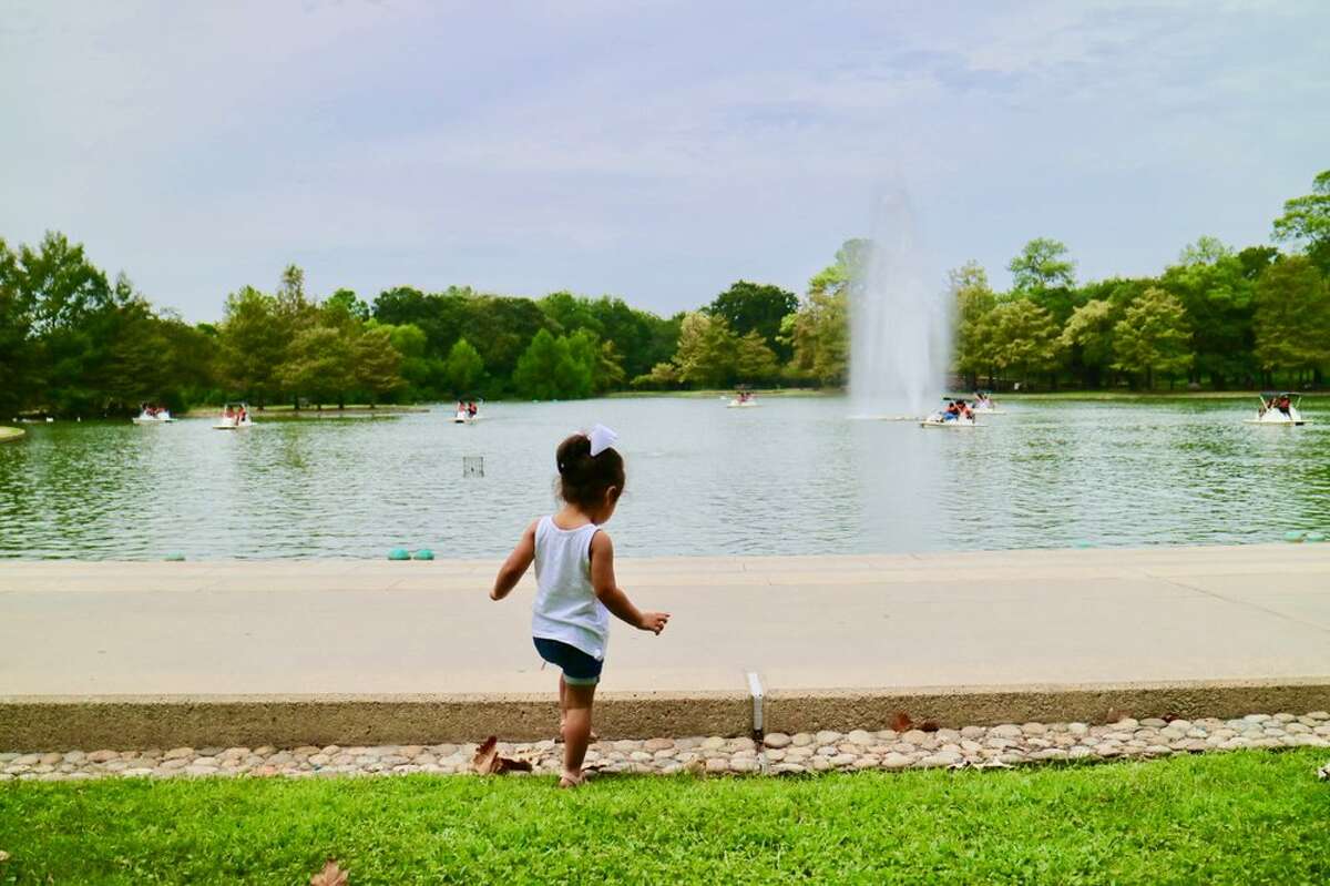 A young child plays at Hermann Park Conservancy.