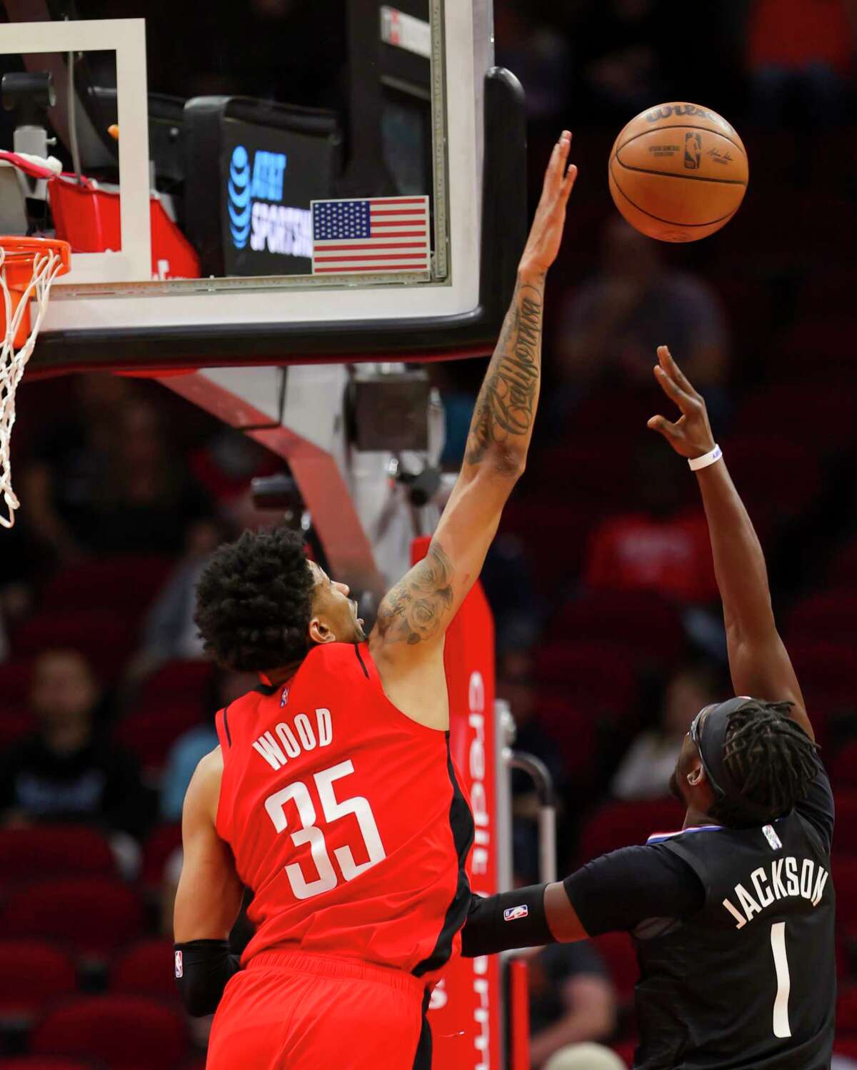 Houston Rockets center Christian Wood (35) tries to block a shot by Los Angeles Clippers guard Reggie Jackson (1) during the first half of an NBA game between the Houston Rockets and Los Angeles Clippers, Tuesday, March 1, 2022, at Toyota Center in Houston.