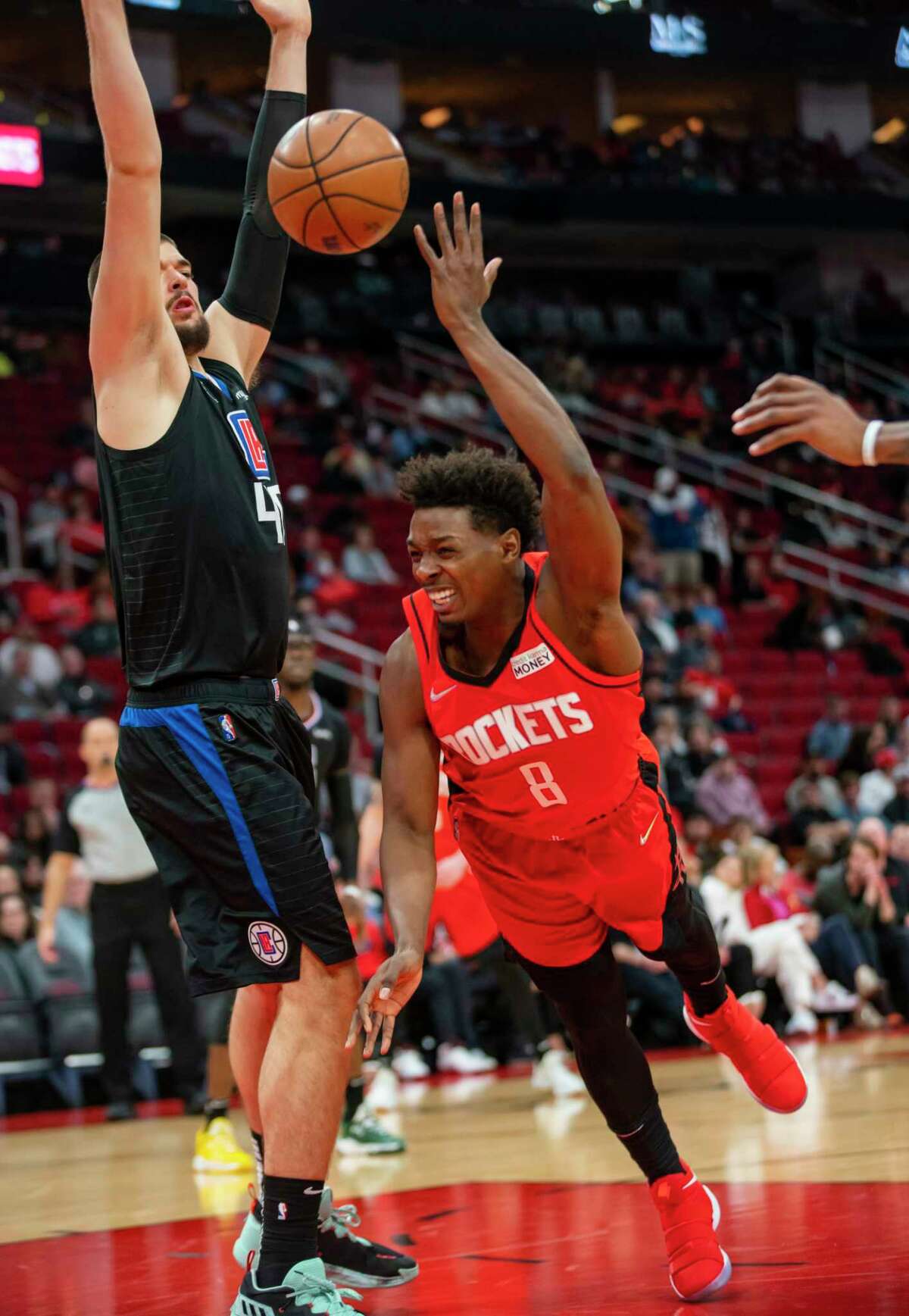 Houston Rockets forward Jae'Sean Tate (8) tries to drive past Los Angeles Clippers center Ivica Zubac (40) during the first half of an NBA game between the Houston Rockets and Los Angeles Clippers, Tuesday, March 1, 2022, at Toyota Center in Houston.