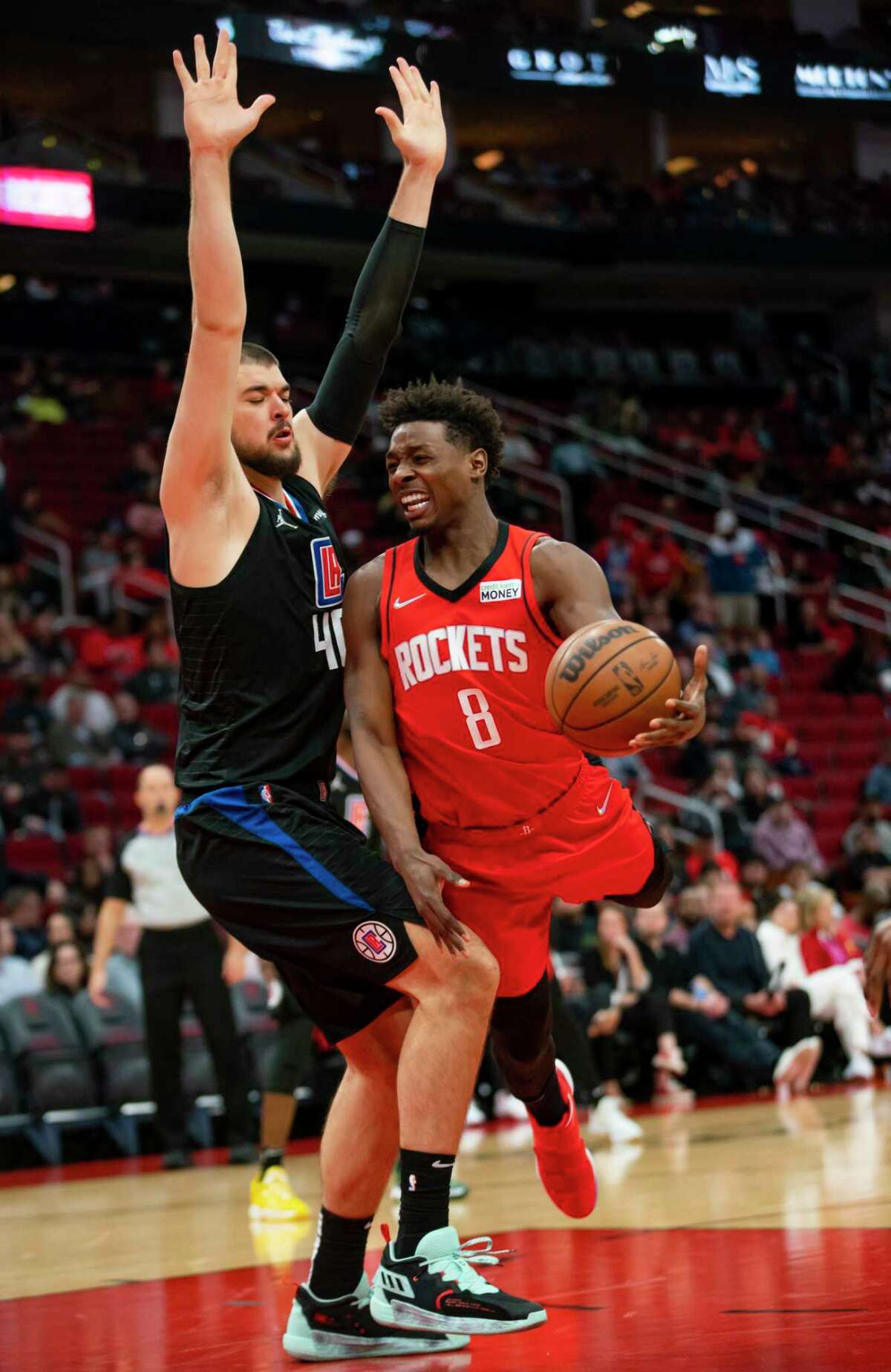 Houston Rockets forward Jae'Sean Tate (8) tries to drive past Los Angeles Clippers center Ivica Zubac (40) during the first half of an NBA game between the Houston Rockets and Los Angeles Clippers, Tuesday, March 1, 2022, at Toyota Center in Houston.