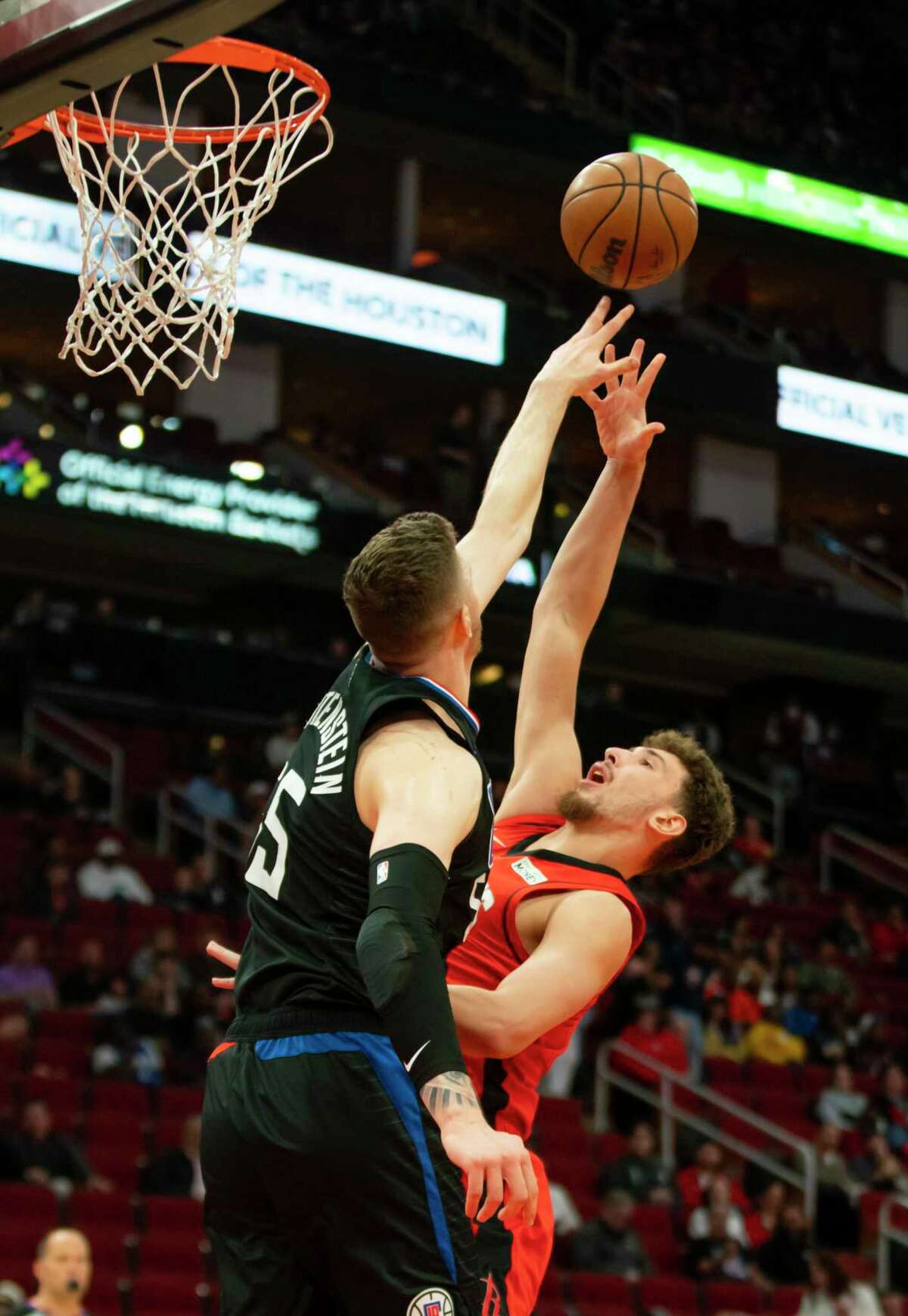 Houston Rockets center Alperen Sengun (28) tries to shoot over Los Angeles Clippers center Isaiah Hartenstein (55) during the first half of an NBA game between the Houston Rockets and Los Angeles Clippers, Tuesday, March 1, 2022, at Toyota Center in Houston.