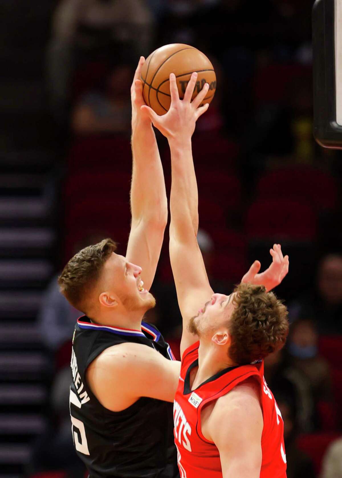 Houston Rockets center Alperen Sengun (28) blocks a shot by Los Angeles Clippers center Isaiah Hartenstein (55) during the first half of an NBA game between the Houston Rockets and Los Angeles Clippers, Tuesday, March 1, 2022, at Toyota Center in Houston.