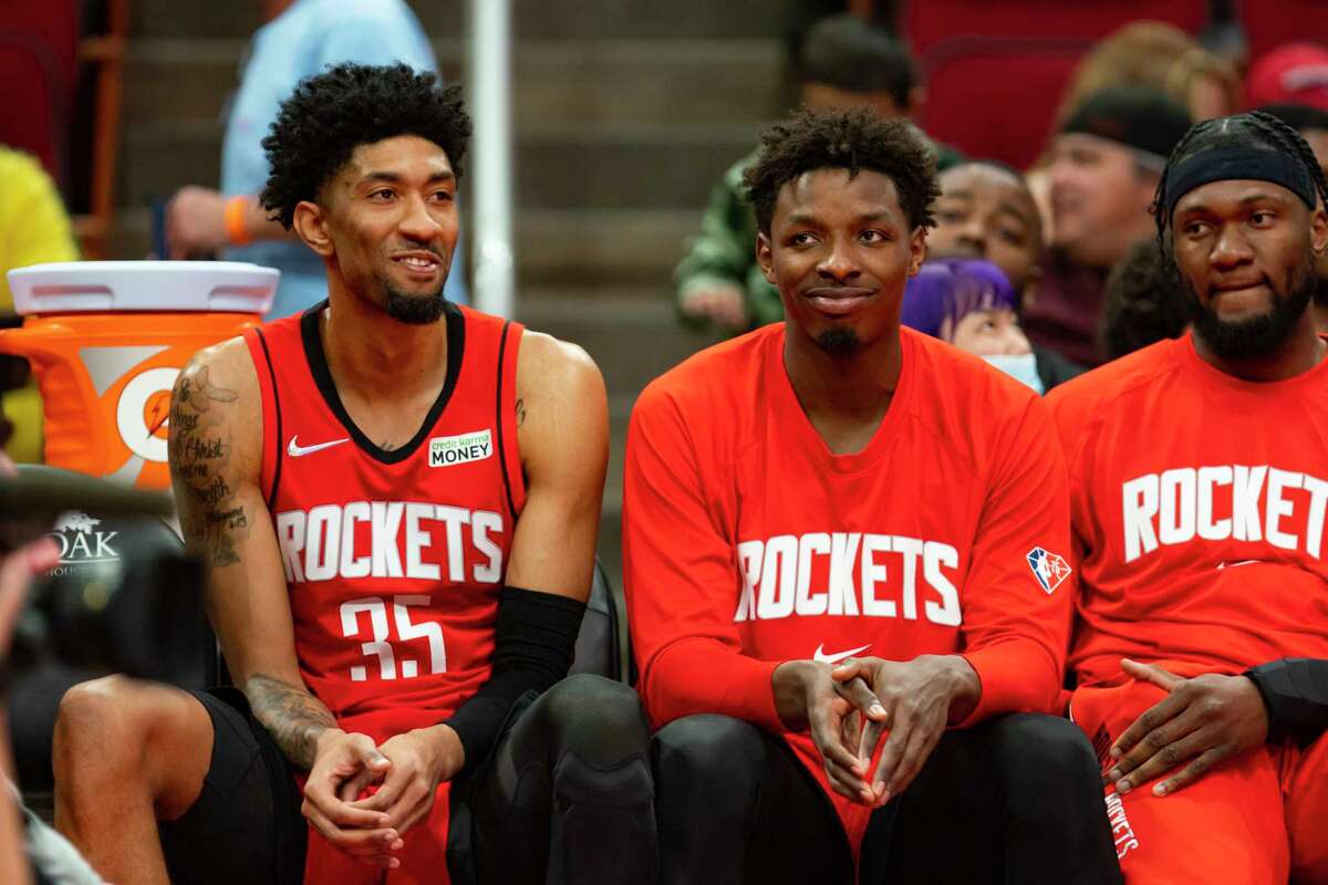 Houston Rockets center Christian Wood (35) and Houston Rockets forward Jae'Sean Tate (8) sit on the bench during the second half of an NBA game between the Houston Rockets and Los Angeles Clippers, Tuesday, March 1, 2022, at Toyota Center in Houston.