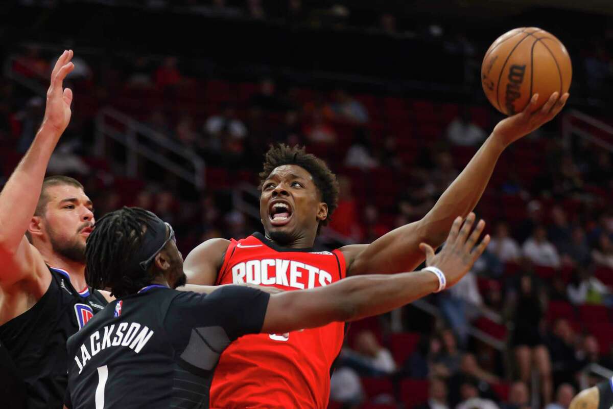 Houston Rockets forward Jae'Sean Tate (8) shoots over Los Angeles Clippers guard Reggie Jackson (1) during the second half of an NBA game between the Houston Rockets and Los Angeles Clippers, Tuesday, March 1, 2022, at Toyota Center in Houston.