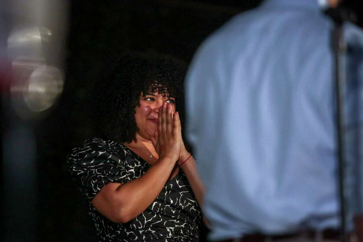 Asha Dane’el reacts as she watches her partner and Congressional candidate Greg Casar address attendees during his campaign watch party at Native Hostel in Austin, Texas, on March 1, 2022. 