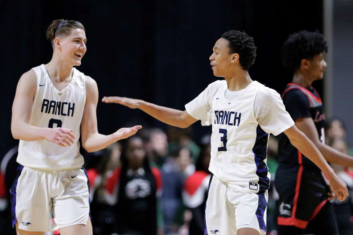 Cypress Ranch’s Justin Norris, left, and Mikey Hawkins, right, celebrate their win over Langham Creek after their UIL Region II-6A boys basketball regional quarterfinals game held at the Berry Center Tuesday, Mar. 1, 2022 in Cypress, TX.