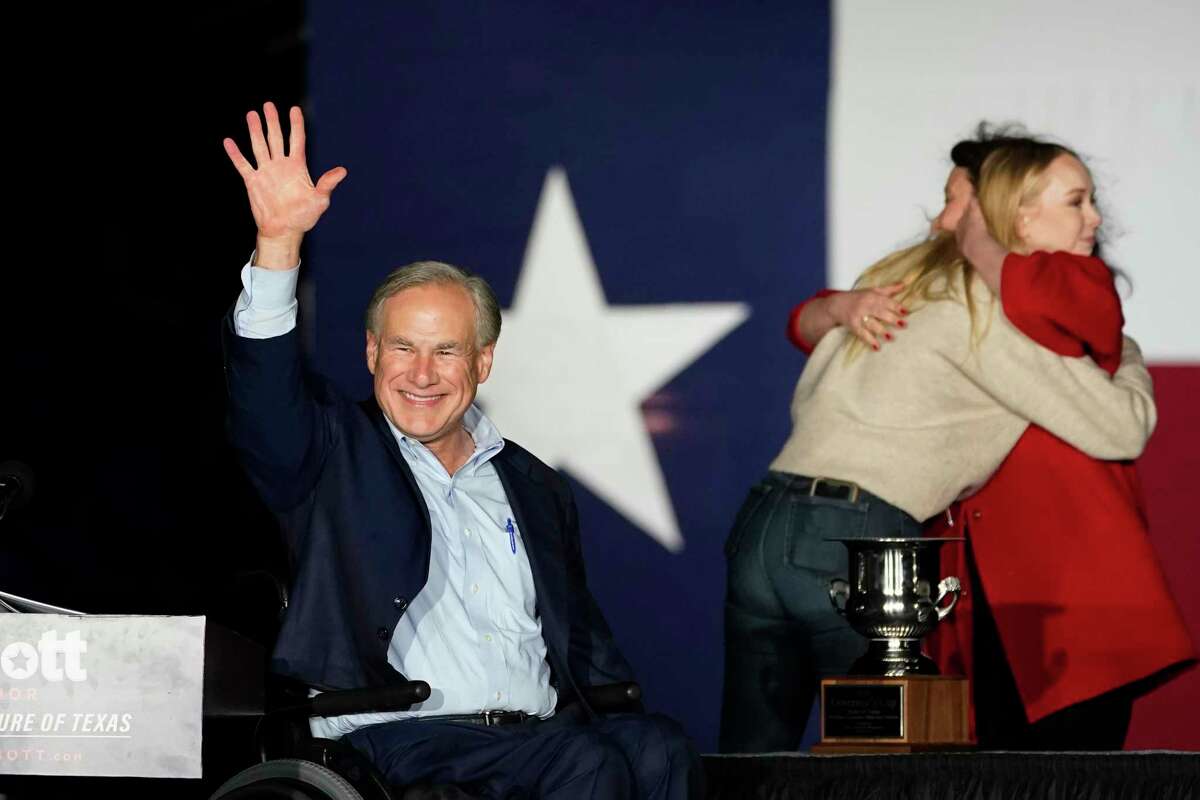 Texas Gov. Greg Abbott, with his wife Cecilia and daughter Audrey, arrives for a primary election night event, Tuesday, March 1, 2022, in Corpus Christi, Texas.