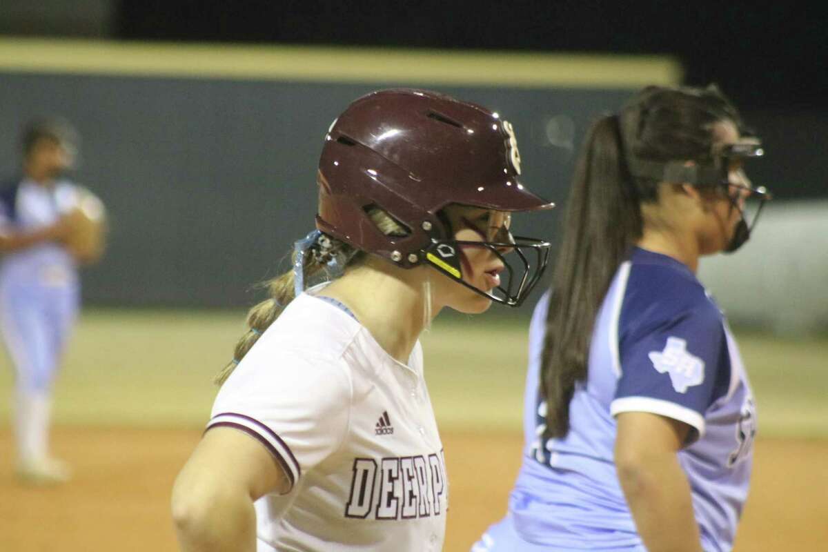 Deer Park's Emma Overla takes a peek at her objective, touching home plate during the 11-run second inning.