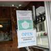 A sign requires face masks at Curly's Diner in Stamford in August. The last of the city-wide mask mandates was lifted Tuesday.