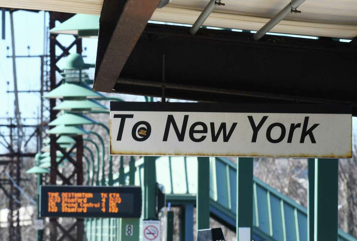 A timetable shows Metro-North train times to Grand Central Terminal at the Greenwich Train Station in Greenwich, Conn. Monday, Feb. 28, 2022.