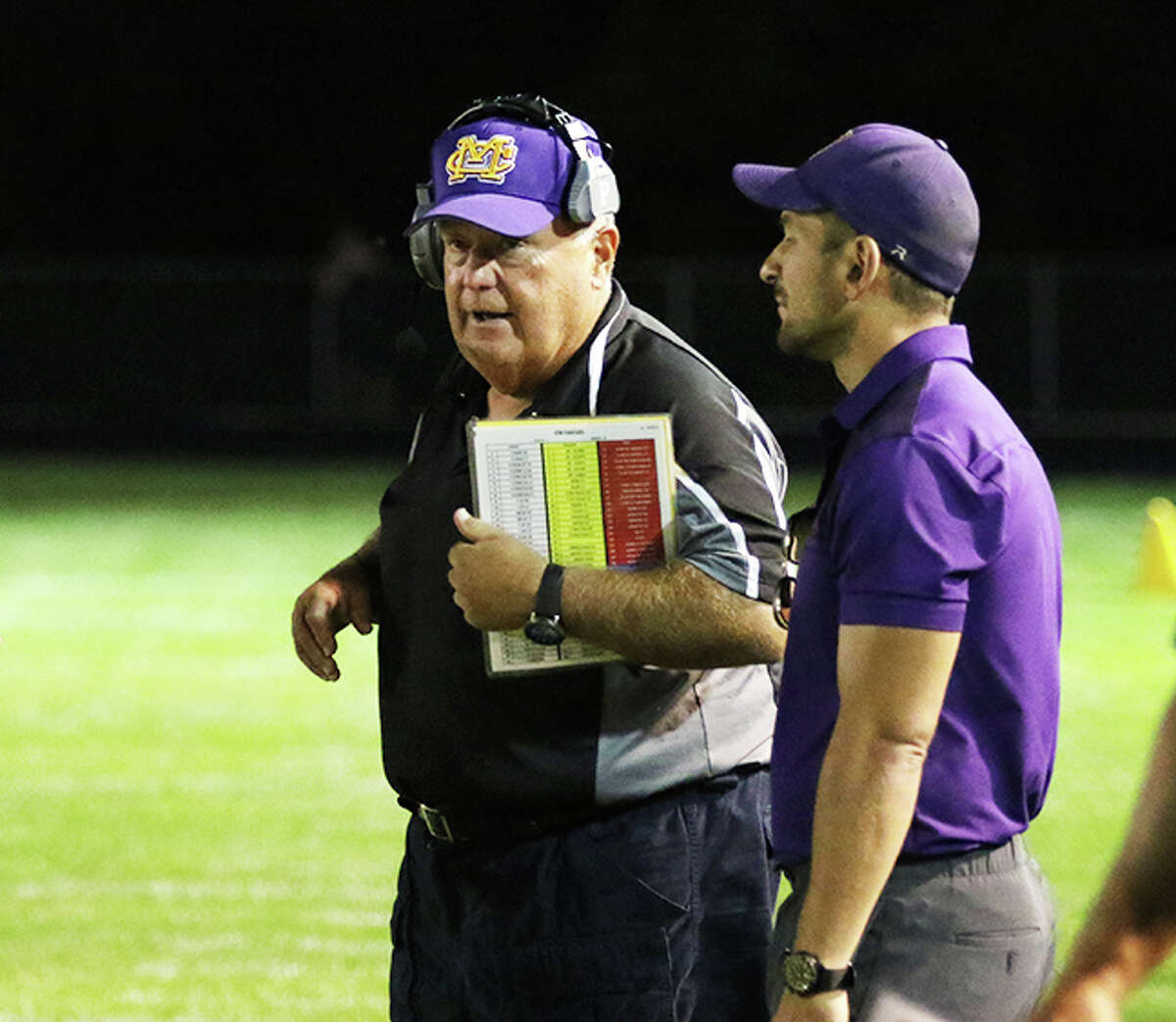 CM assistant coach Rick Reinhart (left) works the sideline during an Eagles game last season in Bethalto. On Tuesday night, Reinhart was approved as CM's new head coach to replace the retired Mike Parmentier. It is Reinhart's second stint in the job, winning 97 games in 18 seasons with the Eagles from 1989-2006.
