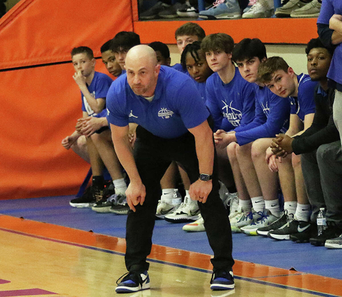 Marquette coach Steve Medford watches his team run offense in the first half against Teutopolis on Tuesday night in the semifinals of the Flora Class 2A Sectional.