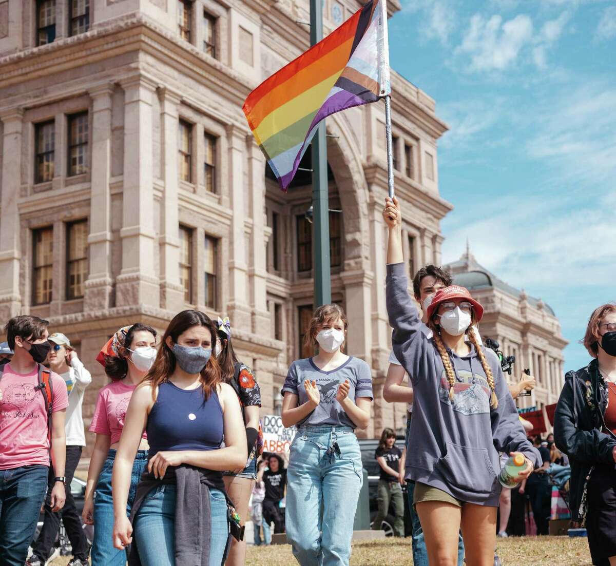 Demonstrators protest a Texas policy to regard gender-affirming treatments for transgender youth as ?’child abuse,?“ at the State Capitol in Austin, Tuesday, March 1, 2022. Texas officials have already begun investigating parents of transgender adolescents for possible child abuse, according to a lawsuit filed on Tuesday. (Christopher Lee/The New York Times)