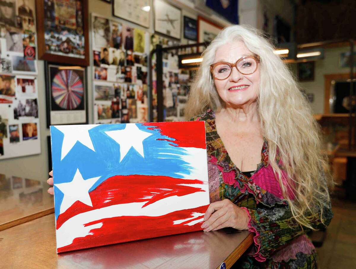 Artist and painter Dody Denman recently donated an American flag painting on canvas to the Honor Cafe in Conroe.