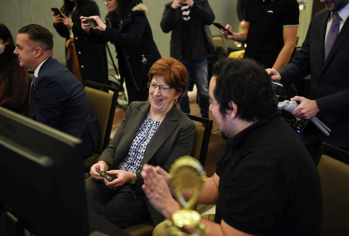 Mayor Kathy Sheehan gets some gaming advice from Michael Crossman, president of Claim Your Fame, a Capital Region e-sports gaming biz, right, during a press conference in advance of this weekend’s Hudson Valley Gamer Con on Wednesday, March 2, 2022, at the Capital Center in Albany, N.Y.