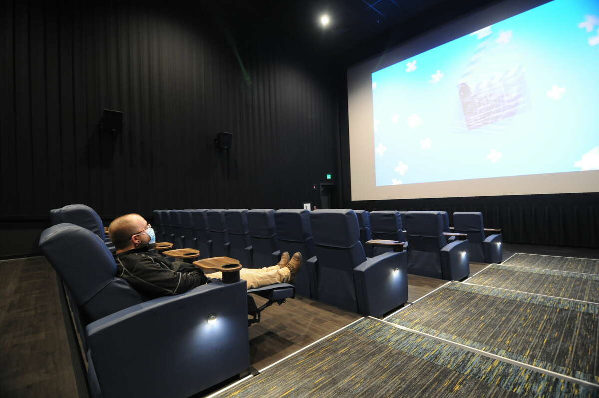 A patron reclines in the specialized seating in one of the NCG Cinema's theaters in Alton. The theater opened in March 2021, and company officials said NCG "couldn't be happier" with being in the Alton Square Mall.   