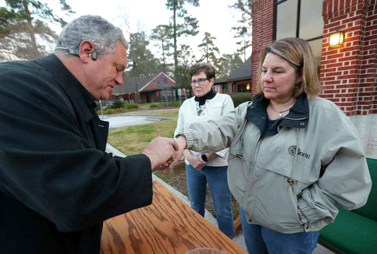 Pastor Chris Lake on Ash Wednesday at Tree of Life Lutheran Church, Wednesday, March 2, 2022, in Conroe. The church’s to-go option made its return after a two year break because of the coronavirus pandemic.
