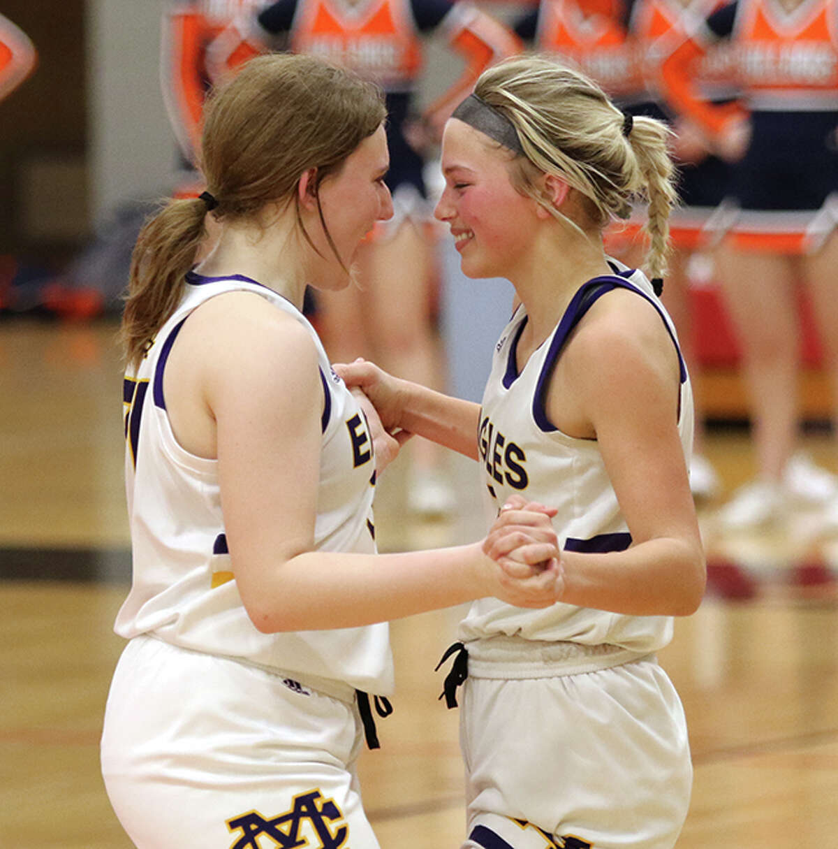 CM junior Olivia Durbin (left) and senior Kelbie Zupan enjoy the final seconds of their Class 3A super-sectional victory over Mahomet-Seymour on Monday night at Highland.