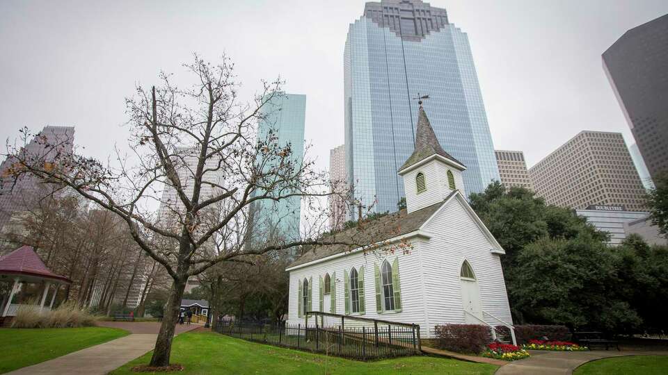 Sam Houston Park is a respite in the shadows of downtown Houston's skyscrapers.