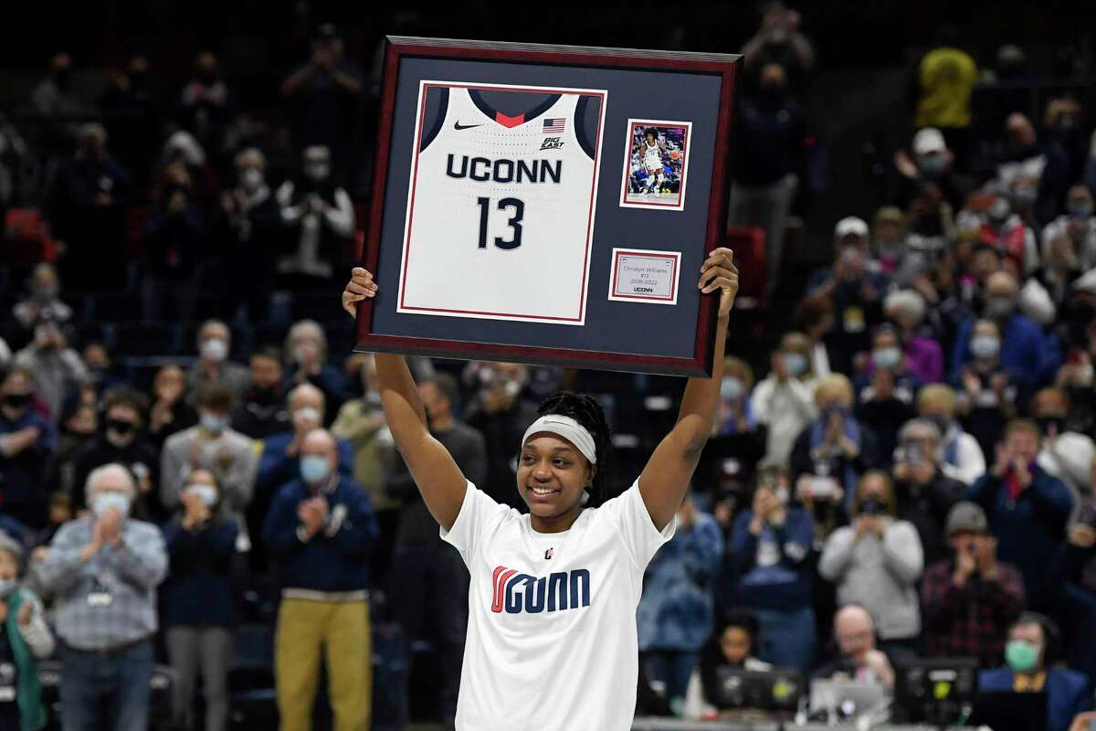 UConn’s Christyn Williams holds up her jersey during senior day ceremonies before an NCAA women’s basketball game on Sunday, Feb. 27, 2022, in Storrs, Conn.