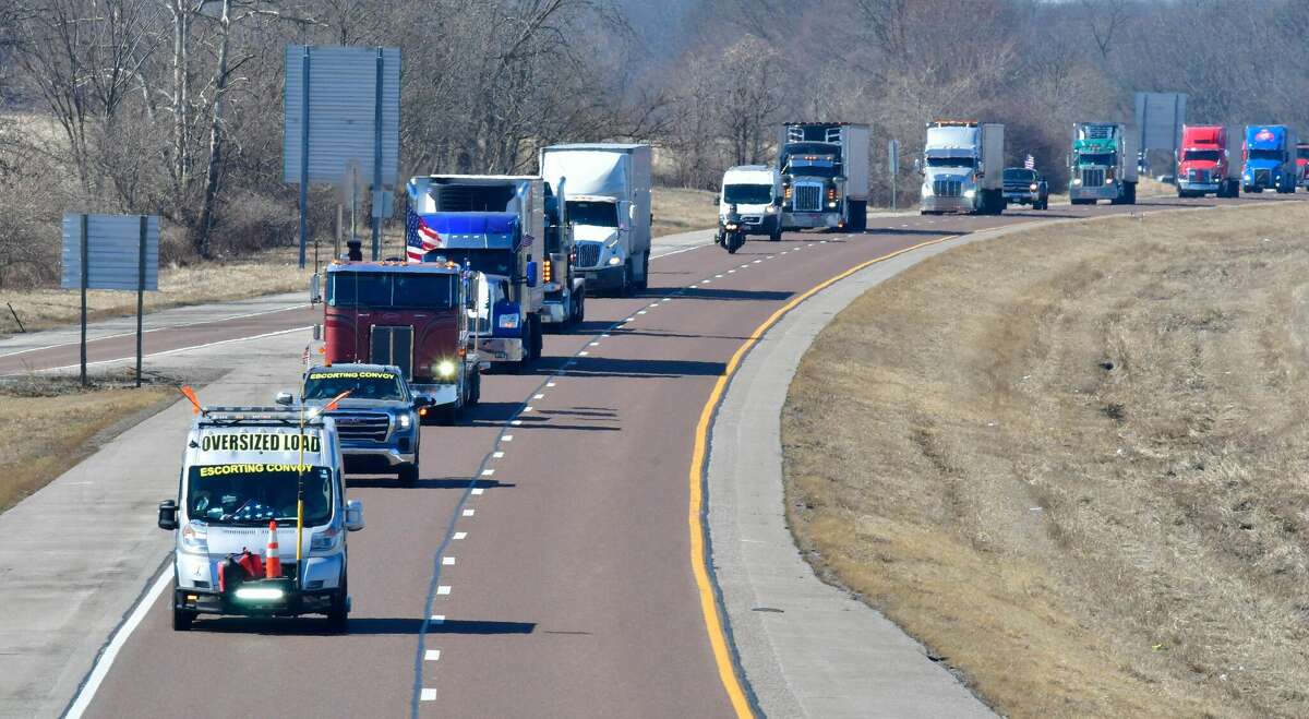 The Peoples Convoy heads east on Interstate 70 near St. Jacob. Truckers crossed into Illinois from Missouri on Tuesday, heading to Washington, D.C., to protest pandemic mandates.