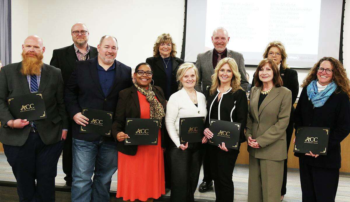Alvin Community College regents recognize staff members who researched the feasibility of offering bachelor’s degree programs. In front are: English chair Thomas Parker, left; Dean of Arts and Sciences John Matula; Dean of Student Support Services Akilah Martin; Dean of General Education and Academic Support Nadia Nazarenko; Dean of Legal and Health Sciences Stacy Ebert; board Secretary Patty Hertenberger; and Executive Director of Institutional Effectiveness and Research Pam Shefman. Behind them are: Director of Institutional Effectiveness and Research Pat Sanger, left; Vice President of Instruction Cindy Griffith; Dean of Professional, Technical and Human Performance Jeff Parks; and board Vice Chair Jody Droege.