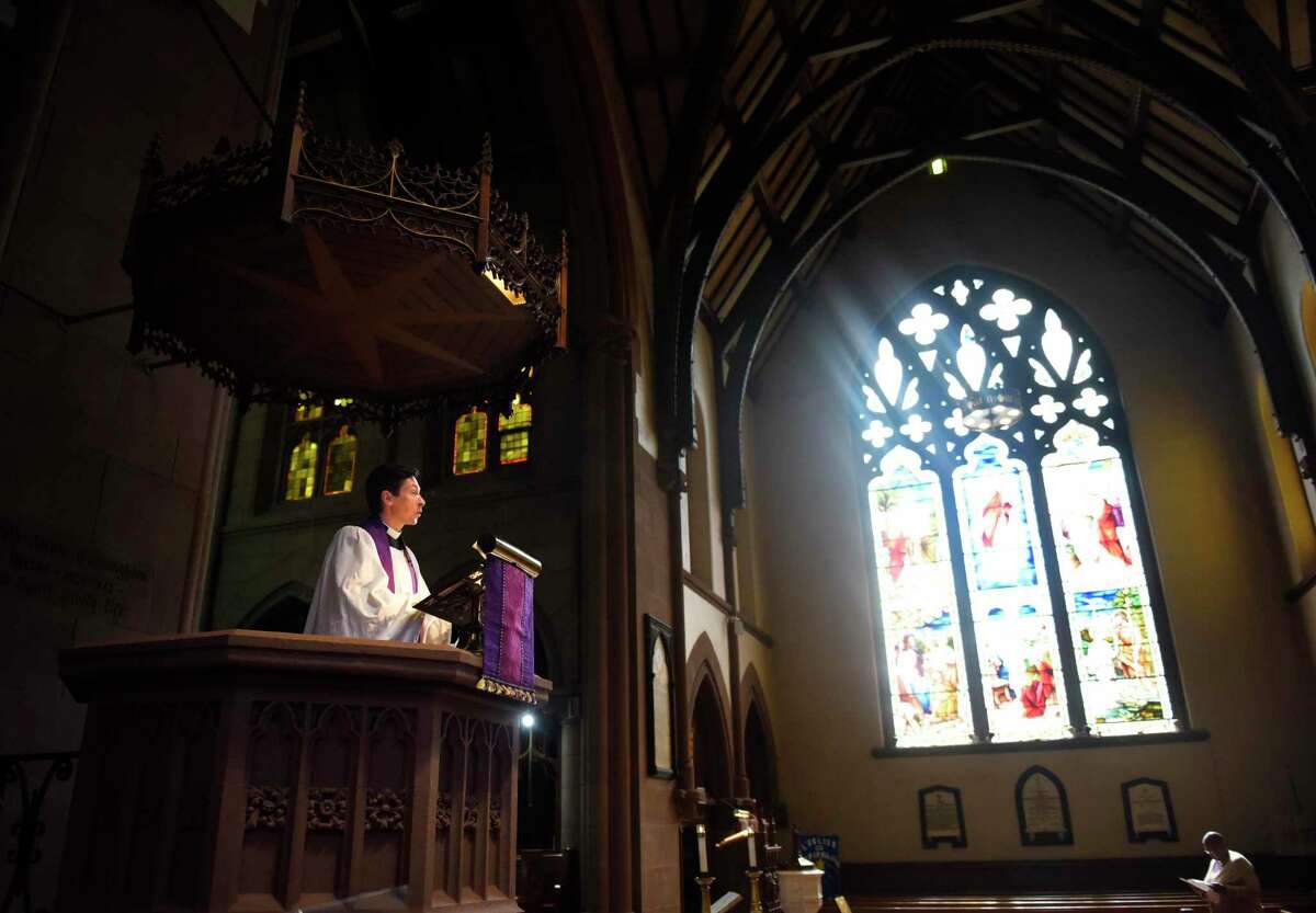 New Priest in Charge the Rev. Andrew Kryzak leads Ash Wednesday Mass at St. John's Episcopal Church in Stamford, Conn. Wednesday, March 2, 2022. Wednesday was the Rev. Kryzak's first Mass at St. John's. From 2016 until 2020, he served Christ Church in Greenwich successively as seminarian, curate, and associate rector for worship, outreach, and membership, but comes most recently from Washington D.C. where he serves as the associate rector of Christ Church in Georgetown.