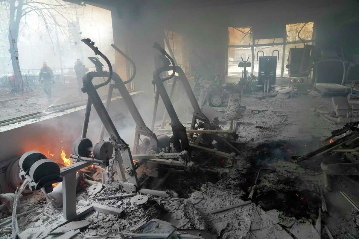 Flames and smoke rise from a damaged gym following shelling in Kyiv, Ukraine, Wednesday, March 2, 2022.
