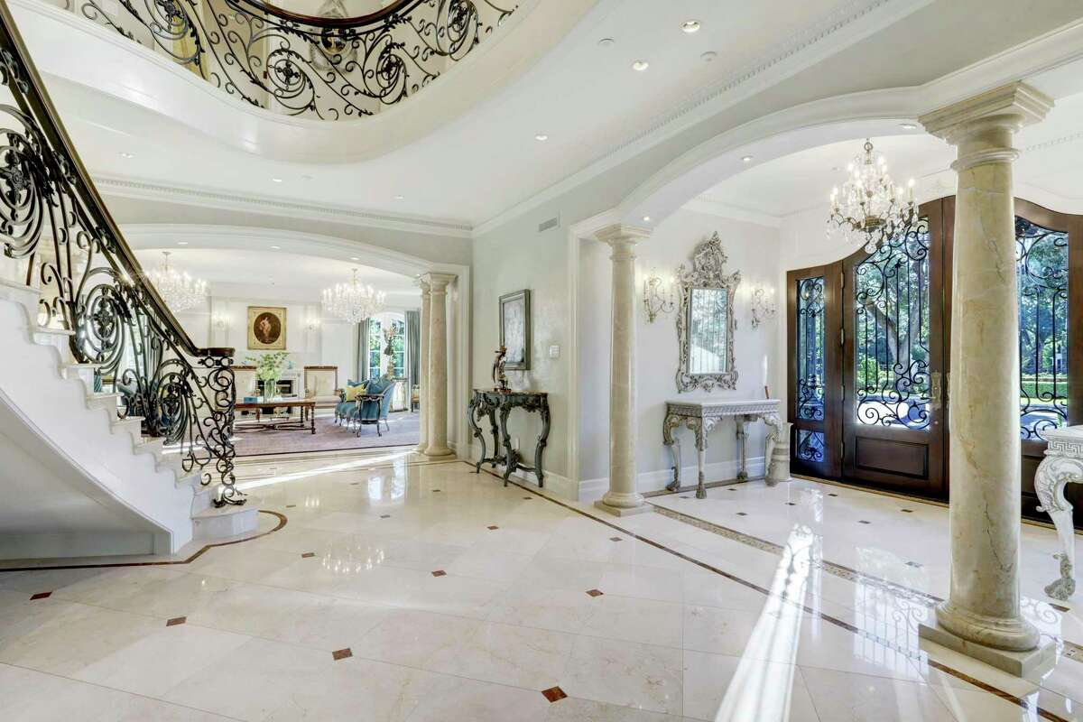 The home has grand foyers and staircases.