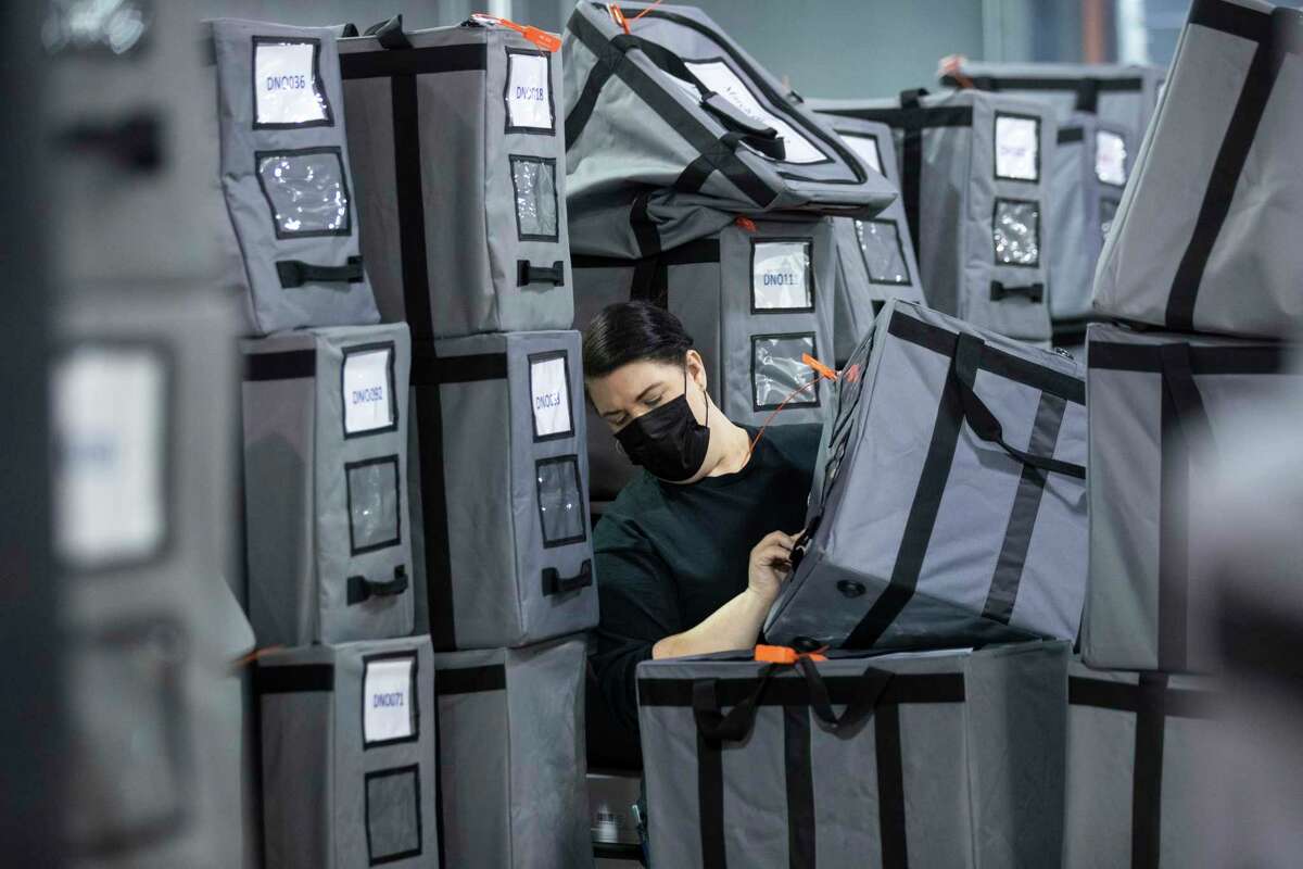 A Harris County election staffer sorts sealed ballot bags after they came in to the Harris County Election Technology Center Wednesday, March 2, 2022 in Houston.