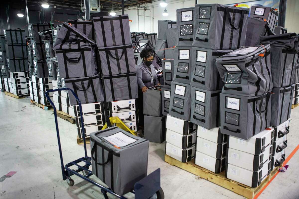 A Harris County election staffer sorts sealed ballot bags after they came in to the Harris County Election Technology Center Wednesday, March 2, 2022 in Houston.