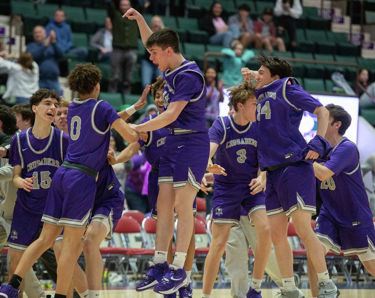 Catholic Central basketball players react to their victory over Tamarac in the Class B semifinal on Wednesday, Mar. 2, 2022 at Cool Insuring Arena in Glens Falls, N.Y. (Jenn March, Special to the Times Union)