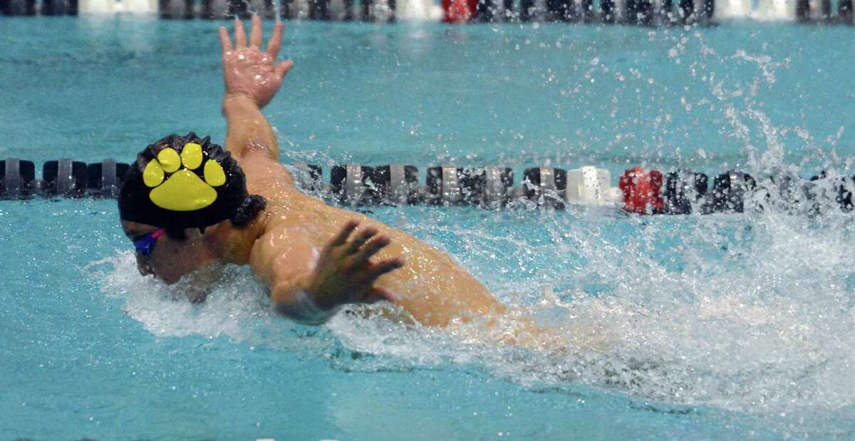 Elliot Lee of Hand swims the final leg on his way to a first-place finish in the 100-yard butterfly in the SCC championship meet on Wednesday in New Haven.