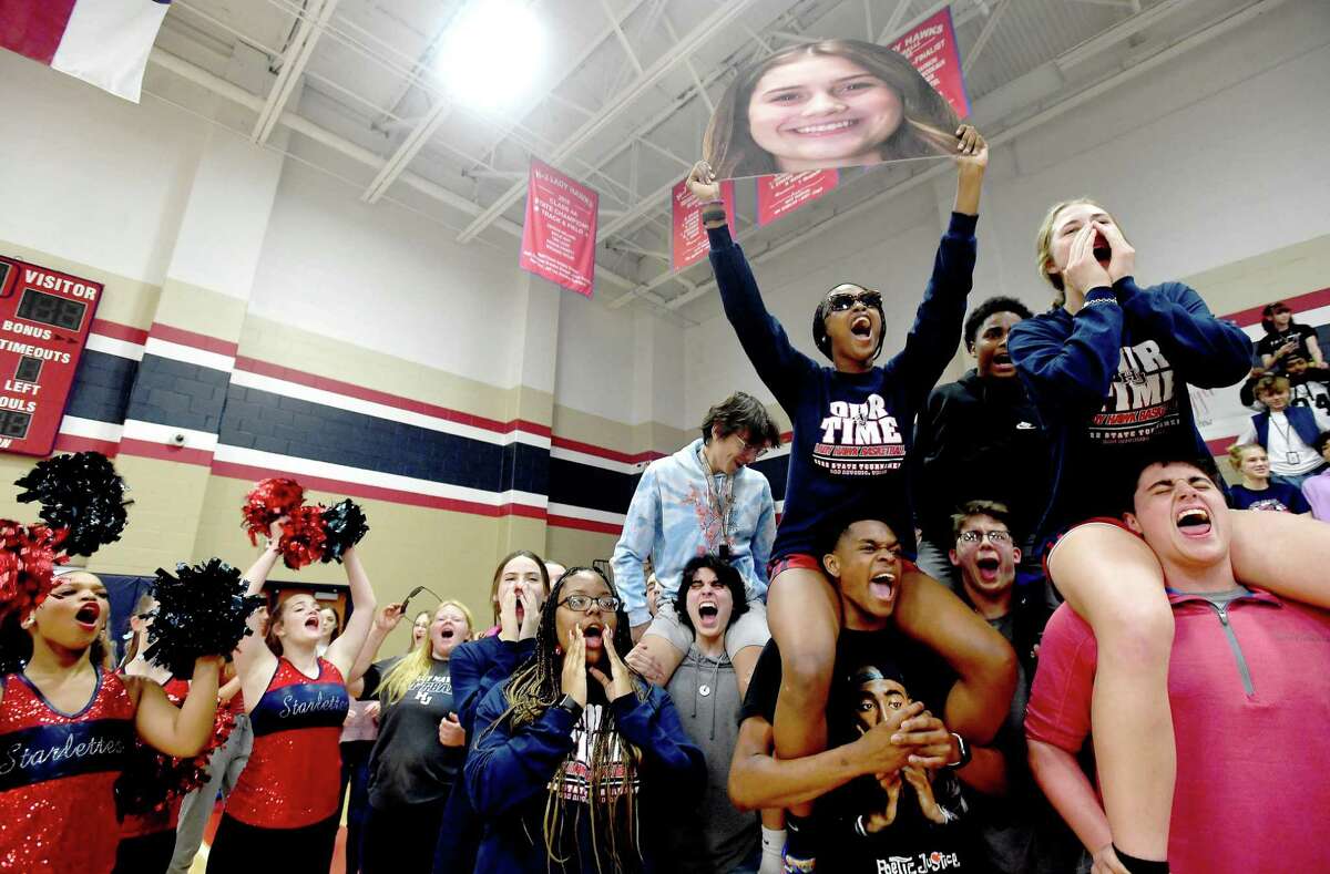 Team members join in the celebration during a pep rally at Hardin-Jefferson High School as the Lady Hawks head off to the state basketball tournament Wednesday. Photo made Wednesday, March 2, 2022 Kim Brent/The Enterprise