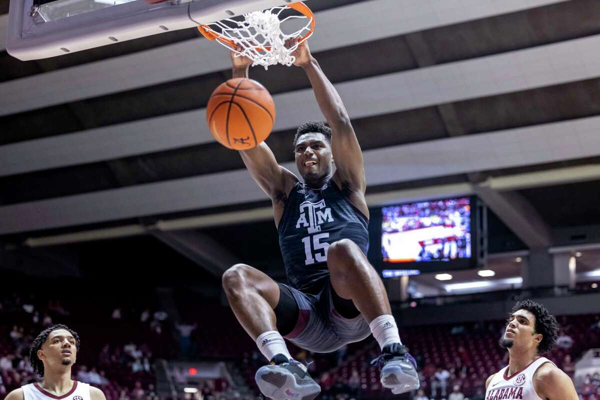 Texas A&M forward Henry Coleman III (15) dunks against Alabama during the second half of an NCAA college basketball game Wednesday, March 2, 2022, in Tuscaloosa, Ala. (AP Photo/Vasha Hunt)
